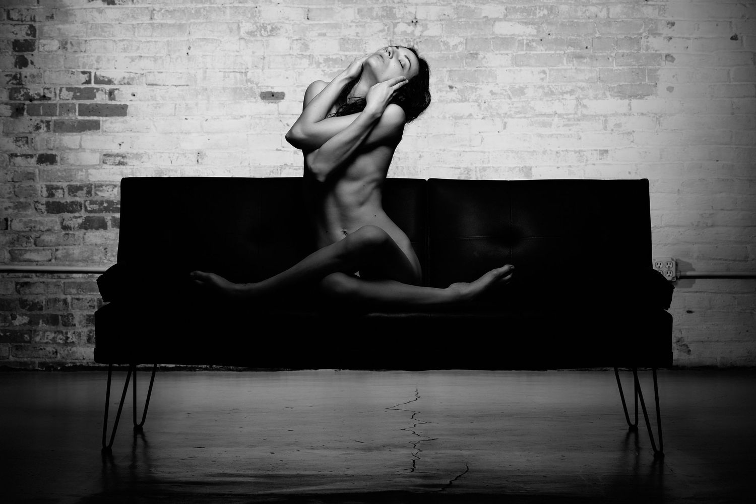David G Holt Photography - Minimalist black and white floor poses creating abstract shapes against dark background.