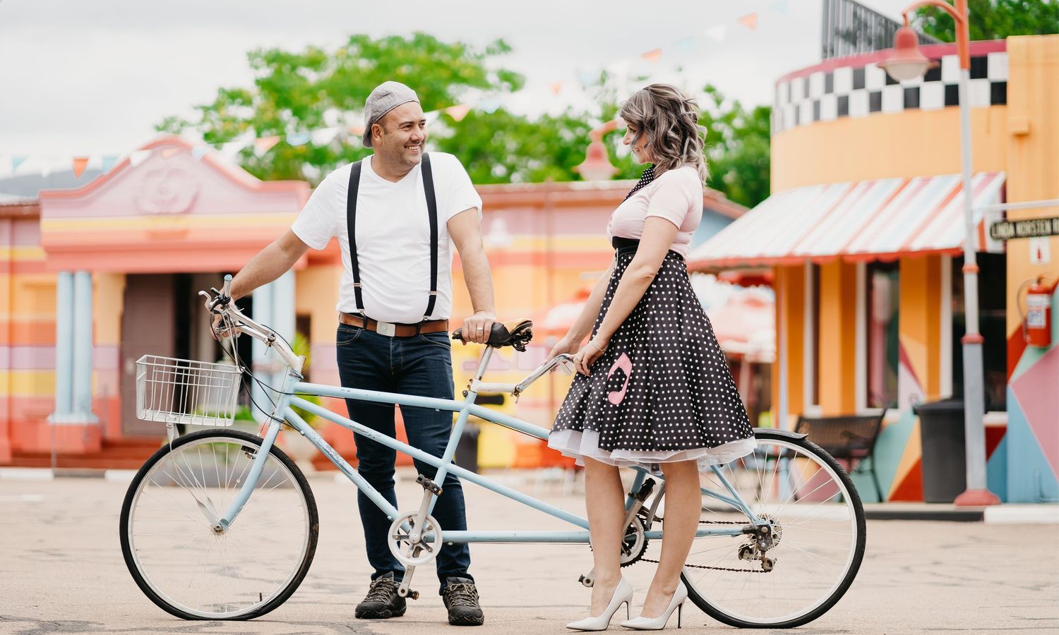 Couple in love with a bicycle at Pretville Movie Set in South Africa