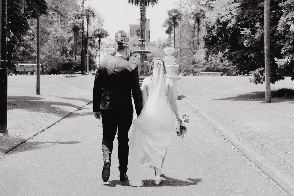 A black and white photo of a couple on their wedding shoot, captured by Apertured Media Auckland Wedding Photographer.
