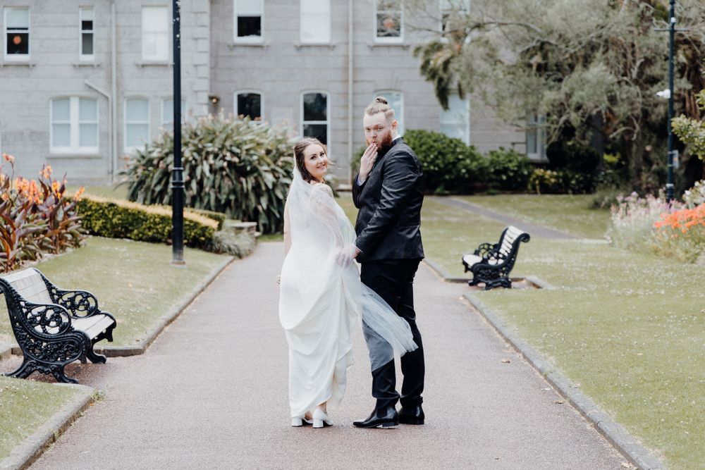 A couple shares a romantic portrait, captured by Apertured Media Auckland Wedding Photographer.
