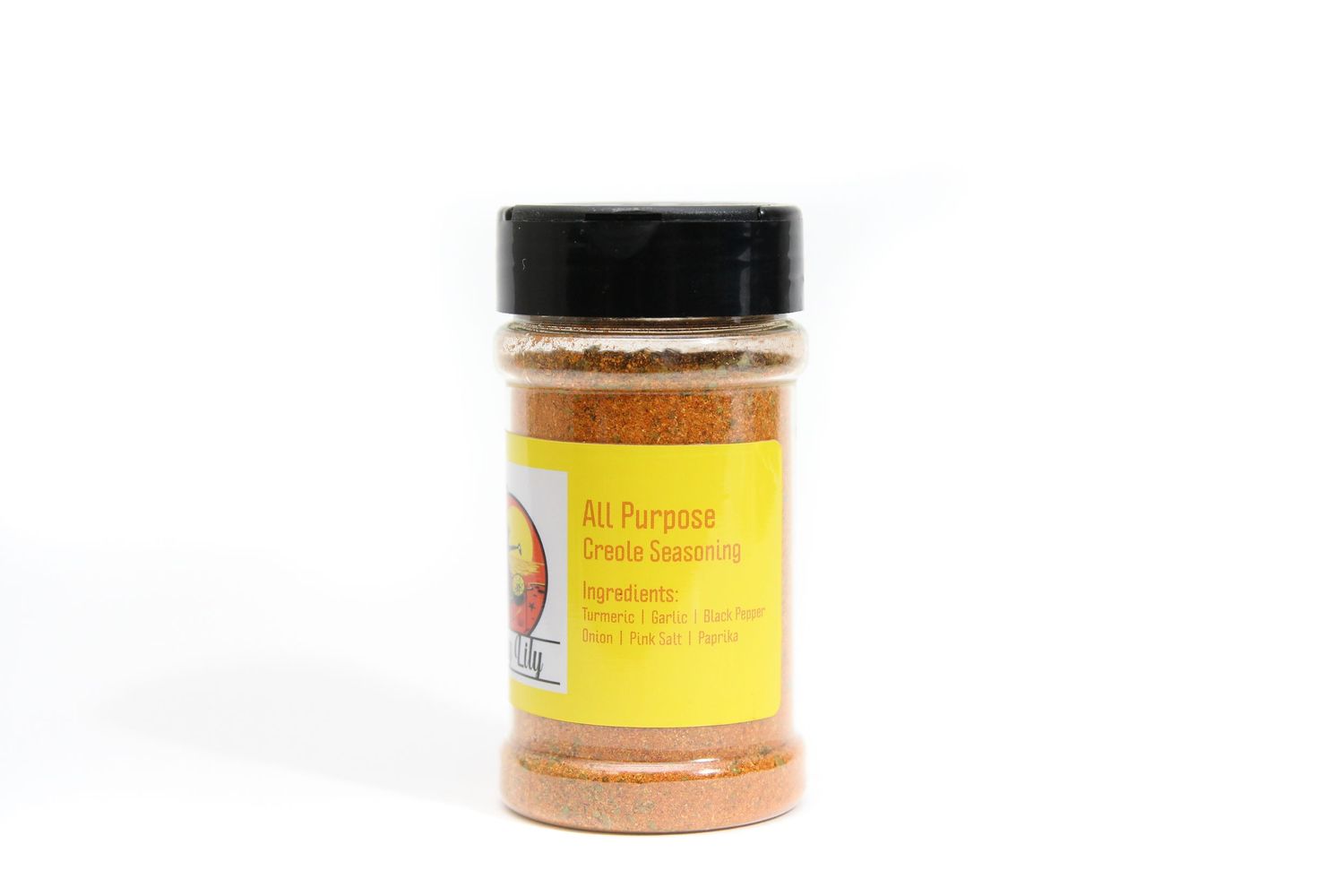 A jar of yellow-labeled spice powder in a clear plastic container with black lid against white background.