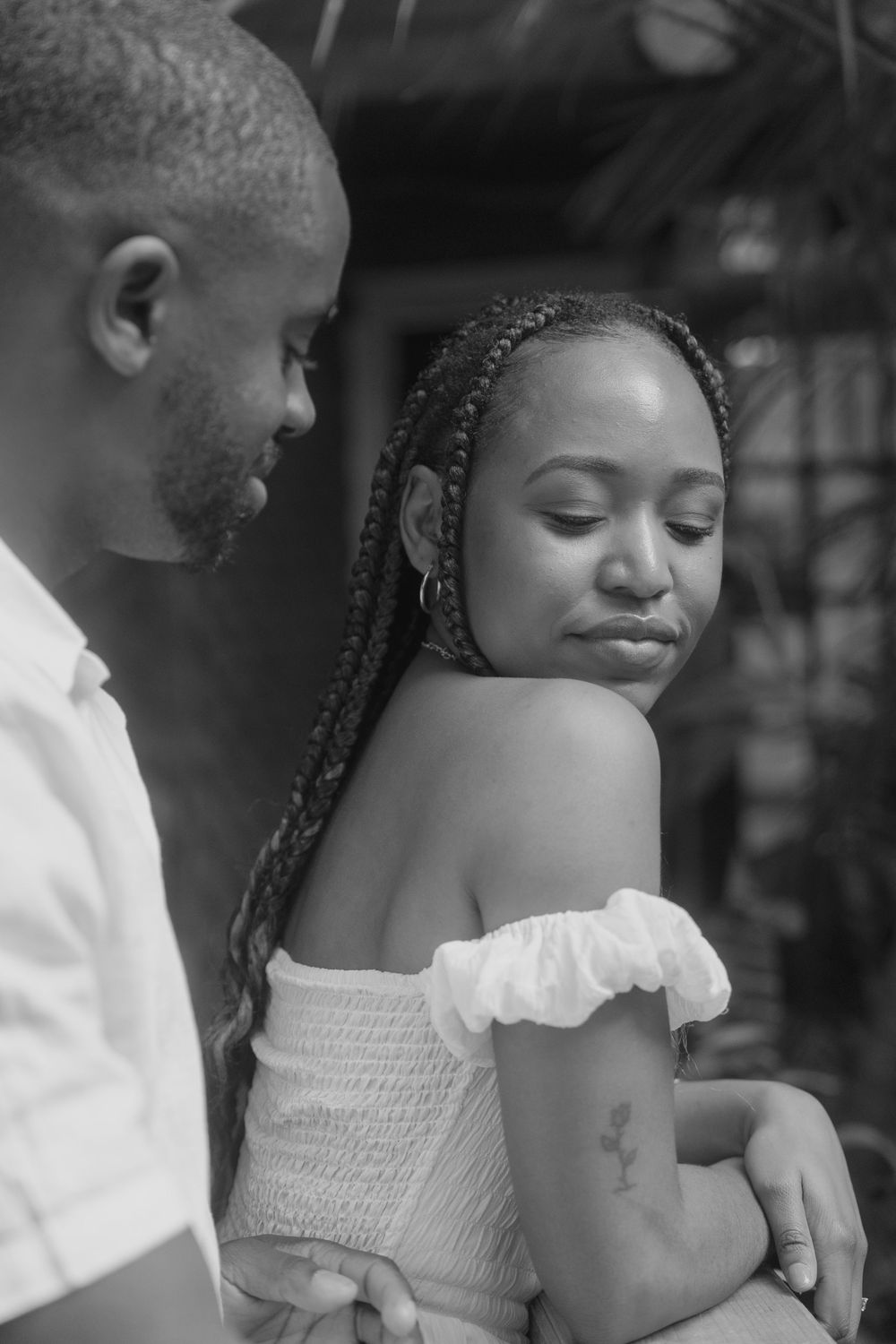 A romantic black and white photo sequence showing an intimate moment between a couple.