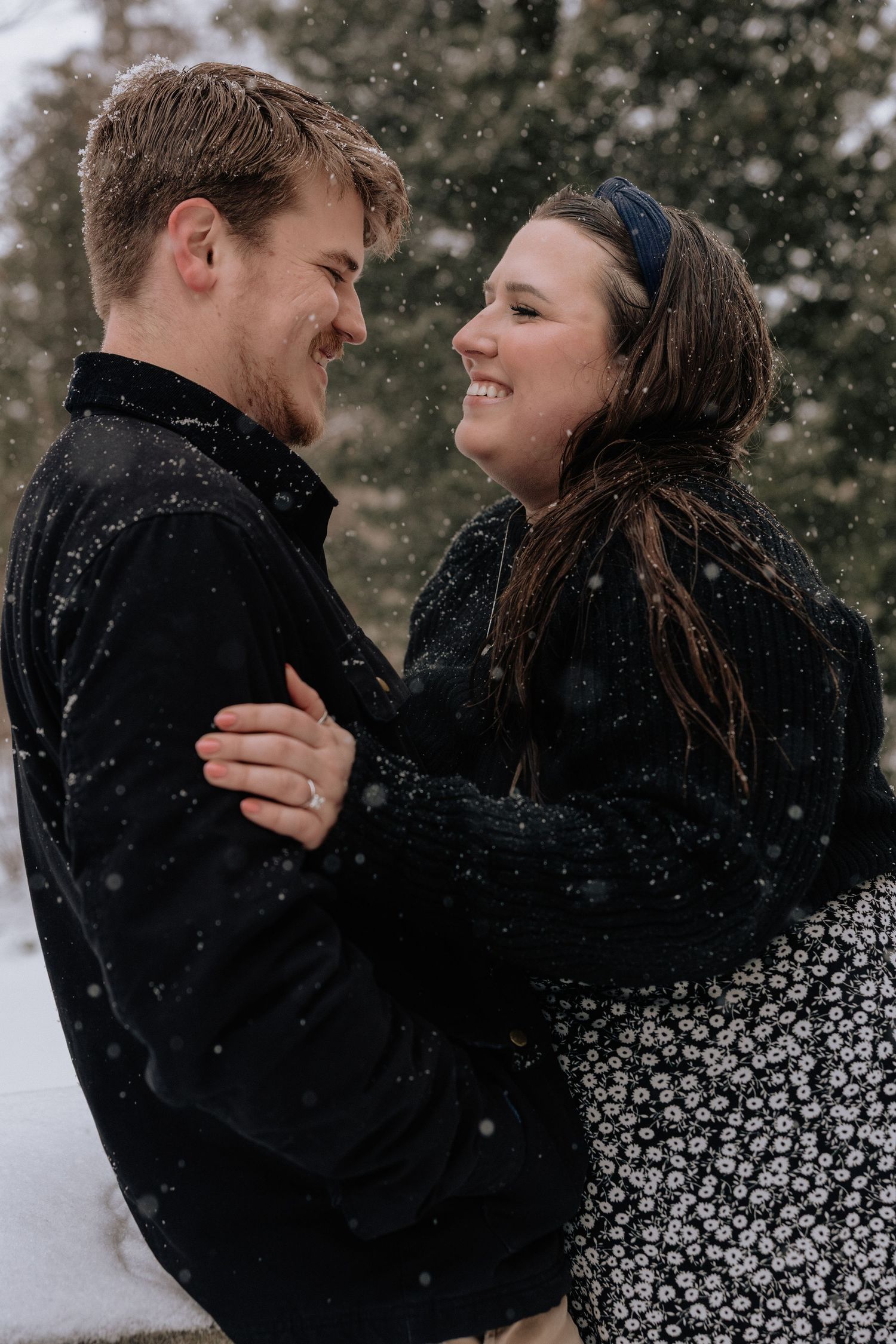 Candid moment between couple at a engagement session in Rochester, NY