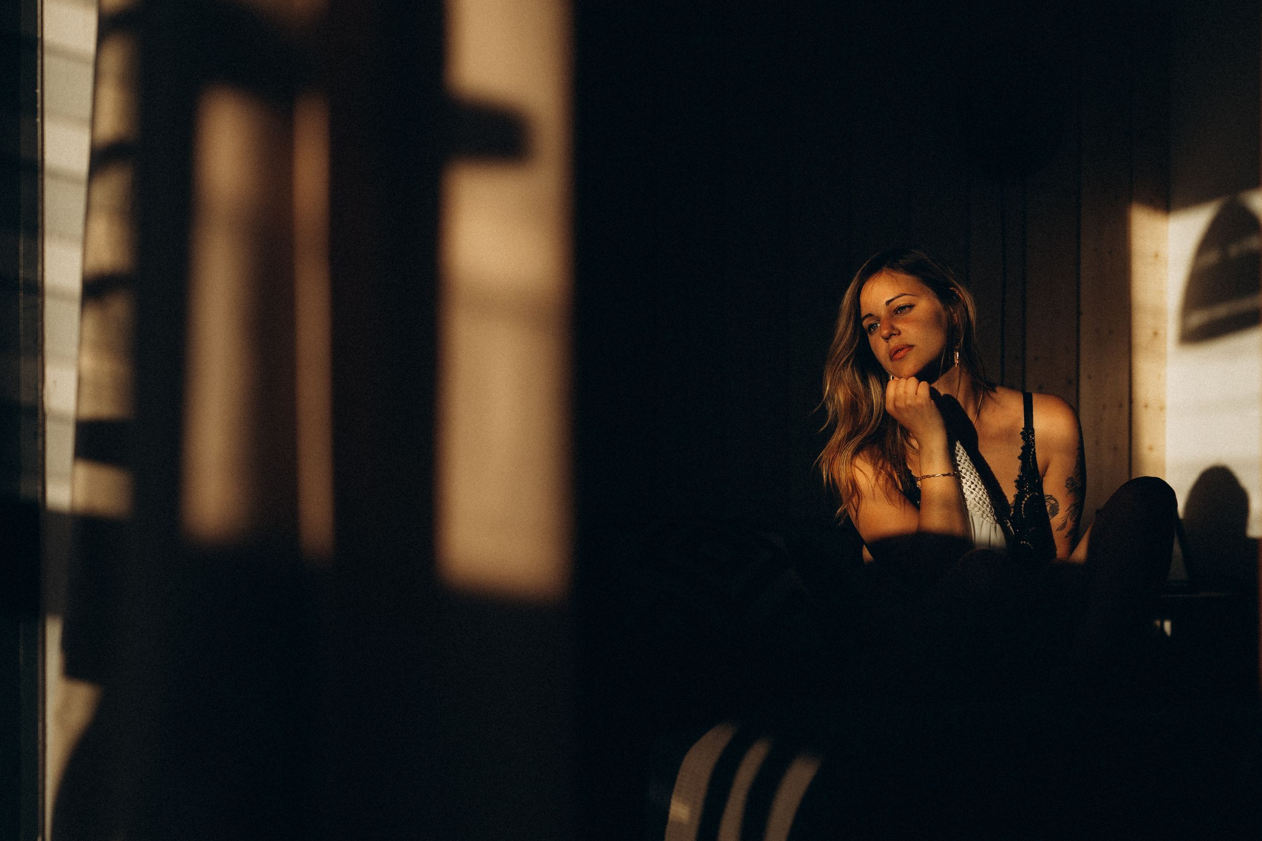 A moody and atmospheric photo series showing dramatic silhouettes against window light in an interior space.