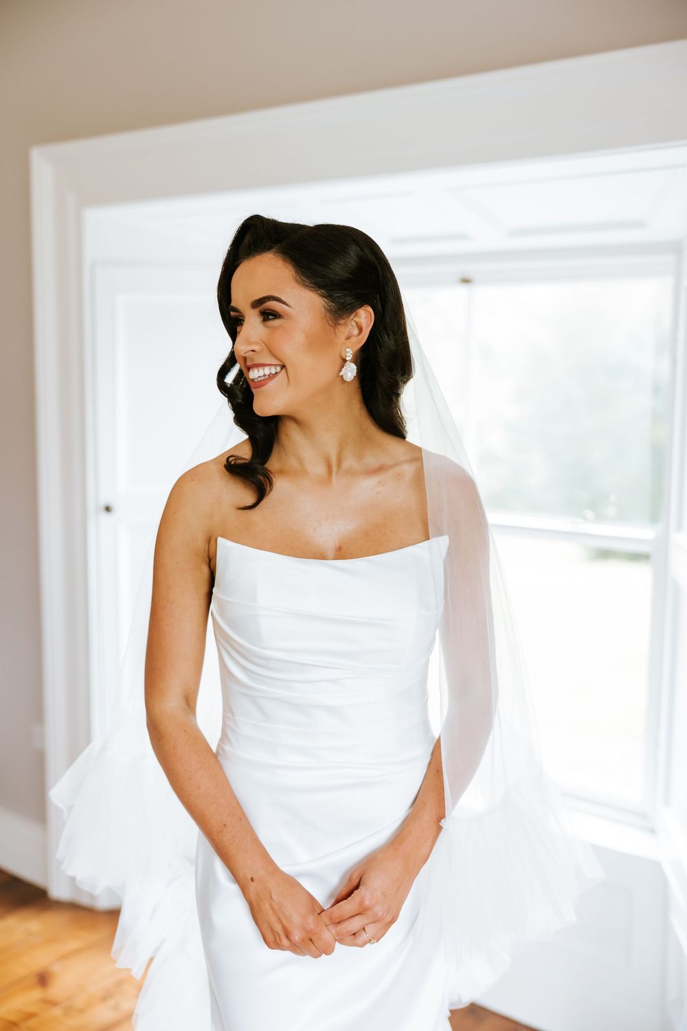 Candid bridal portraits featuring a white wedding gown Bellingham Castle Conlon Photo & Film