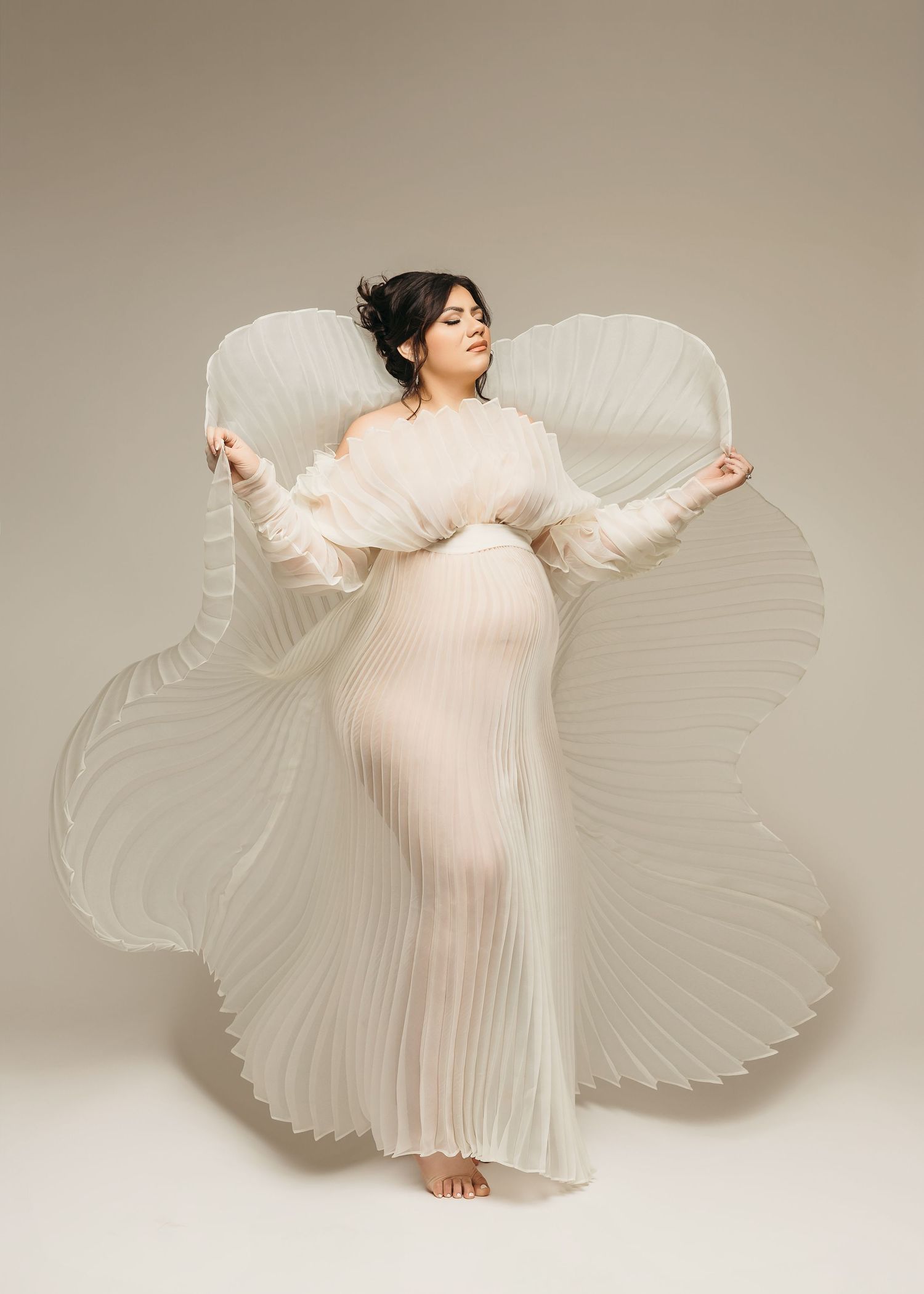 Classic studio maternity photos with flattering lighting in Edmond Oklahoma