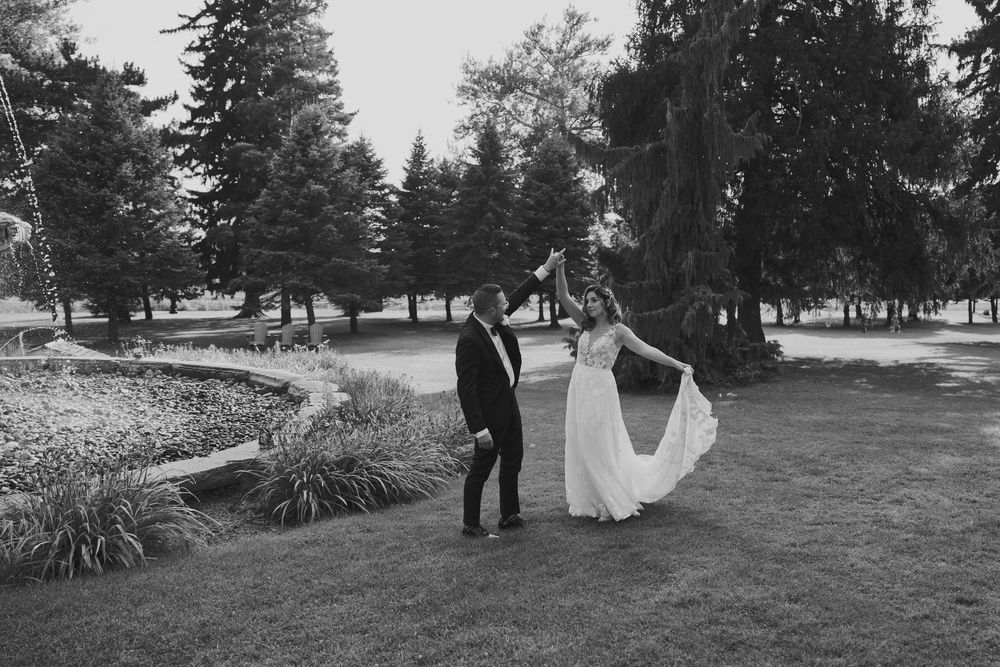 A romantic black and white wedding photo series showing a couple in a scenic outdoor garden setting.