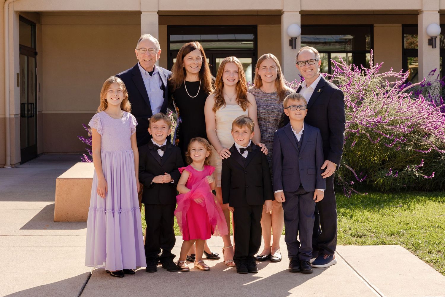 A collage of outdoor family photos showing people in formal attire gathered for special occasions.