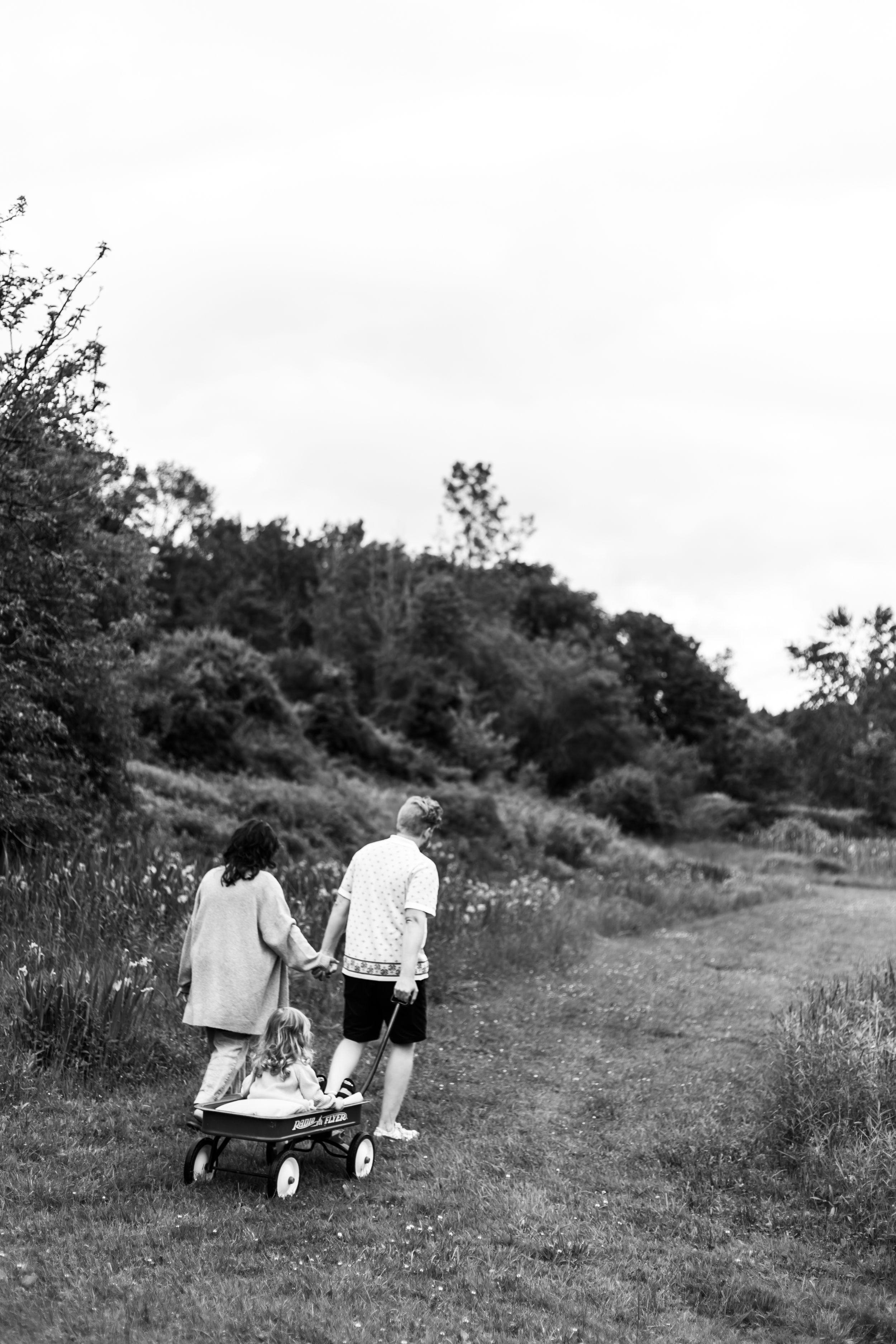 A collection of black and white photographs showing people walking and interacting outdoors in casual settings.
