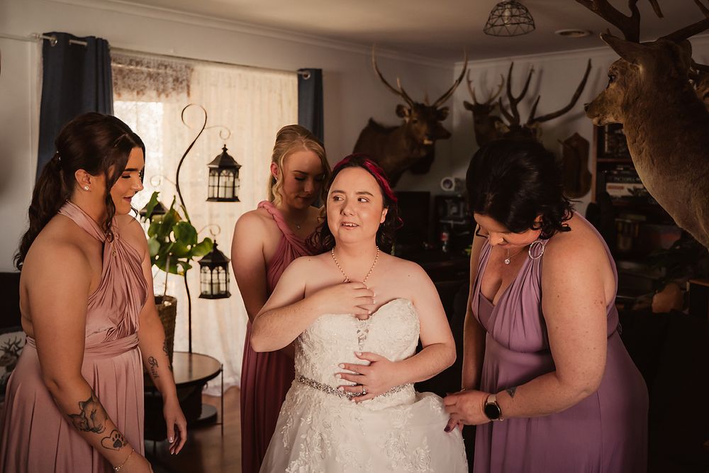 A series of candid moments at a wedding reception showing guests in purple bridesmaid dresses interacting and dancing.