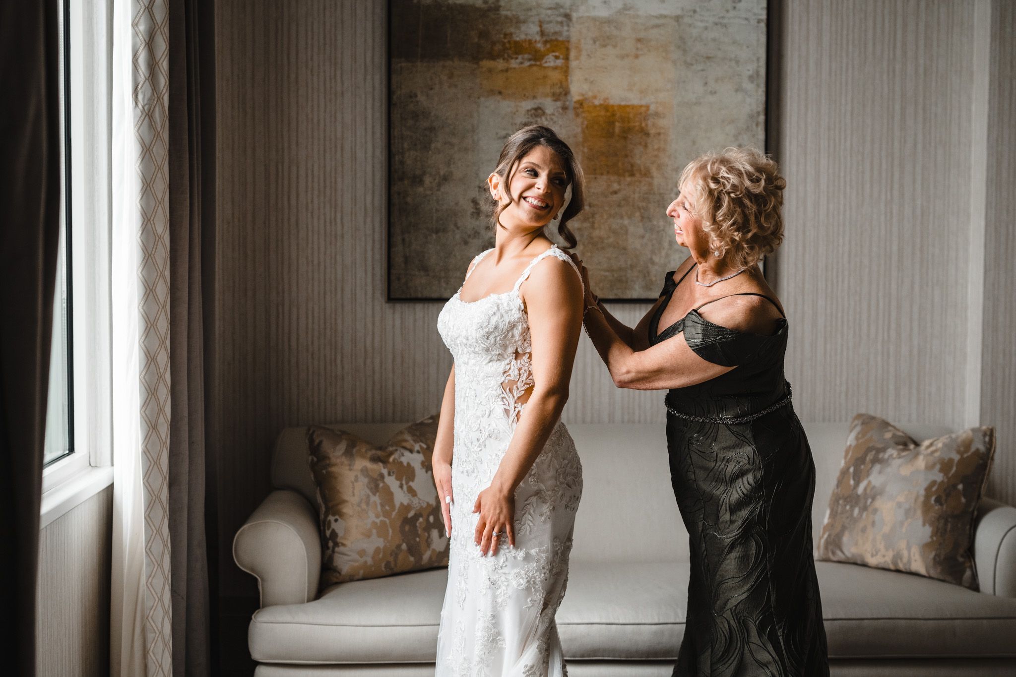 Elegant bridal preparation moments captured in a modern room with rustic accents.