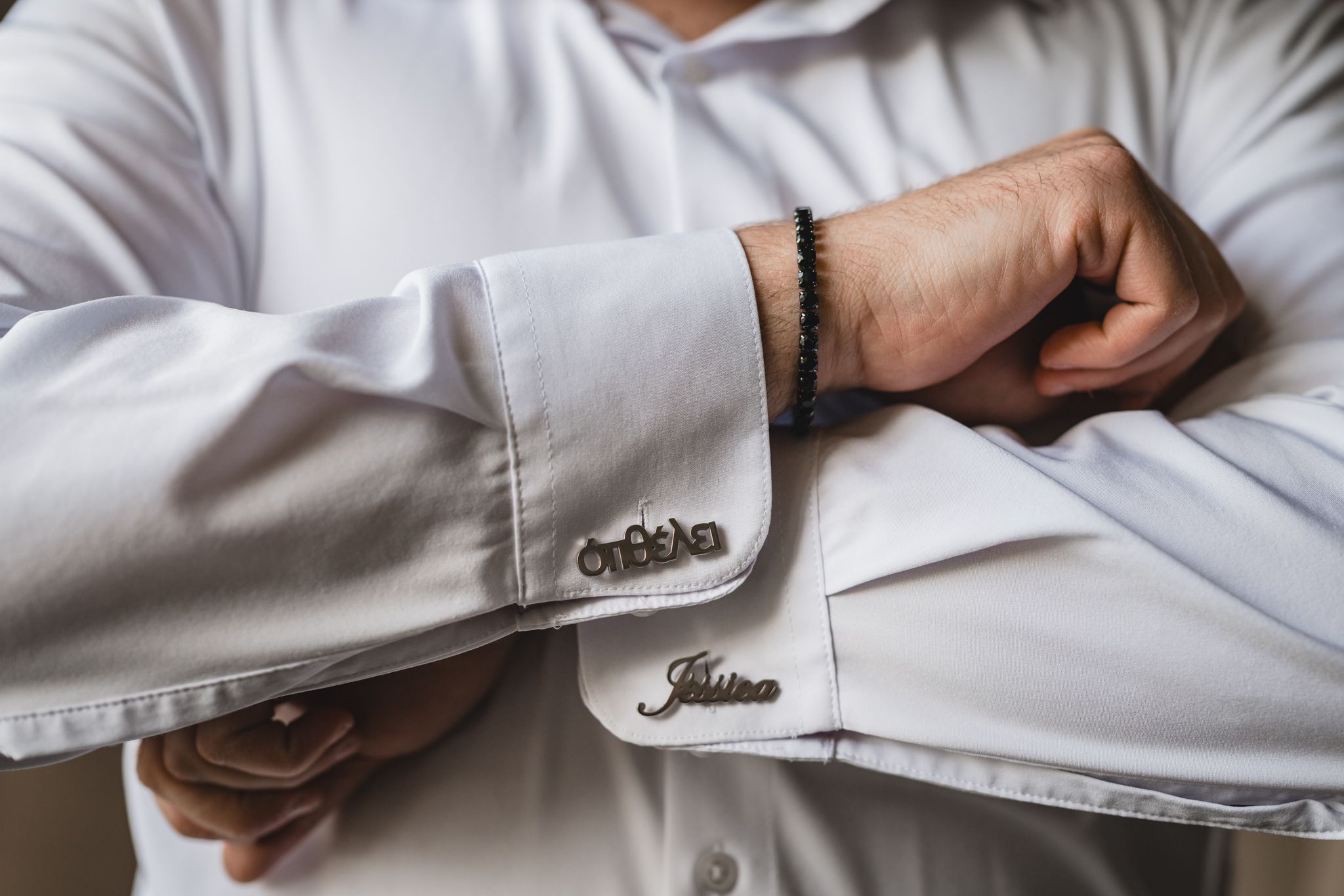 Detail shots of dress shirt cuffs and formal wear accessories in natural light.