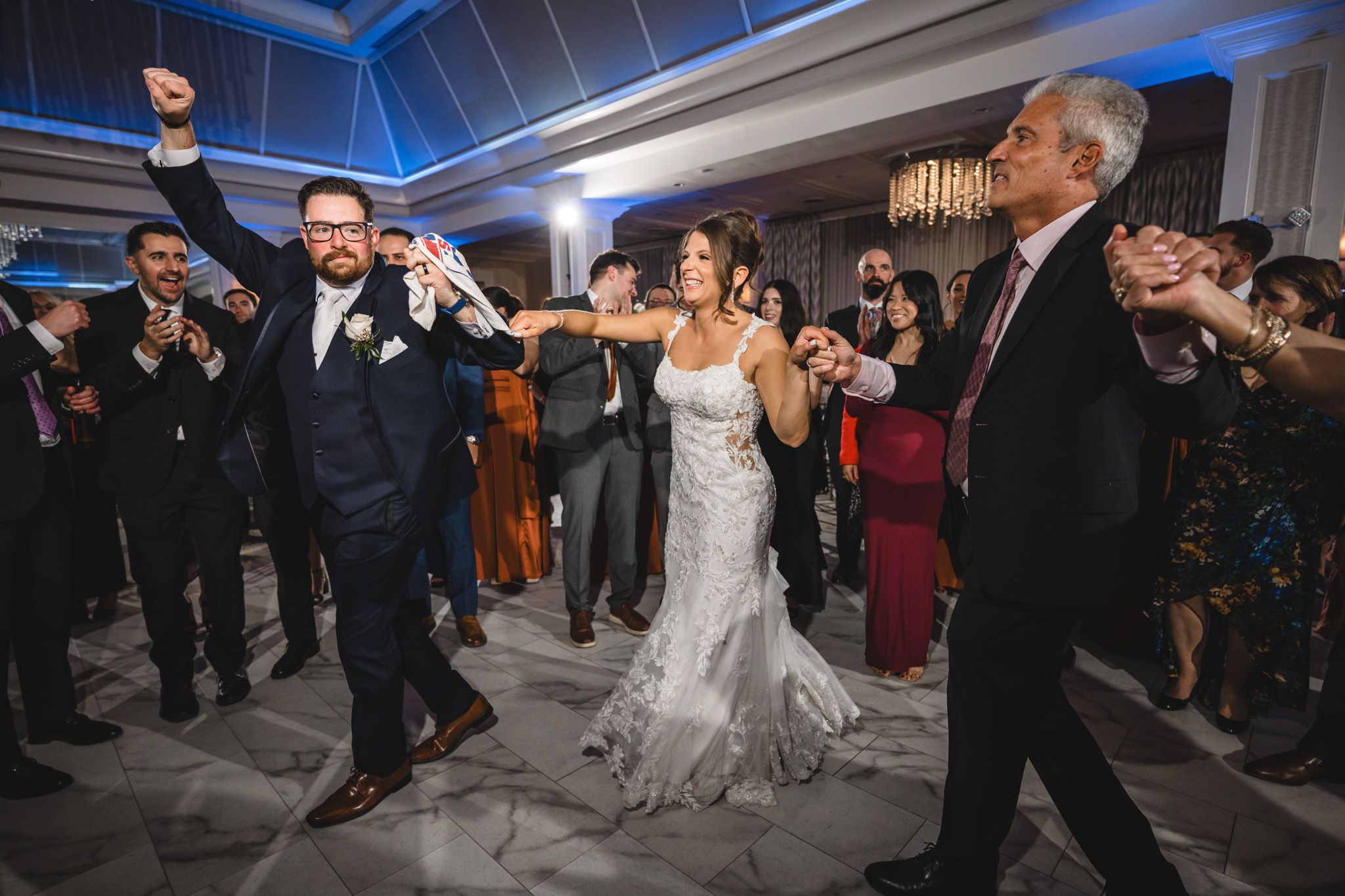 Wedding dance celebration with fog effects in an elegant ballroom setting.