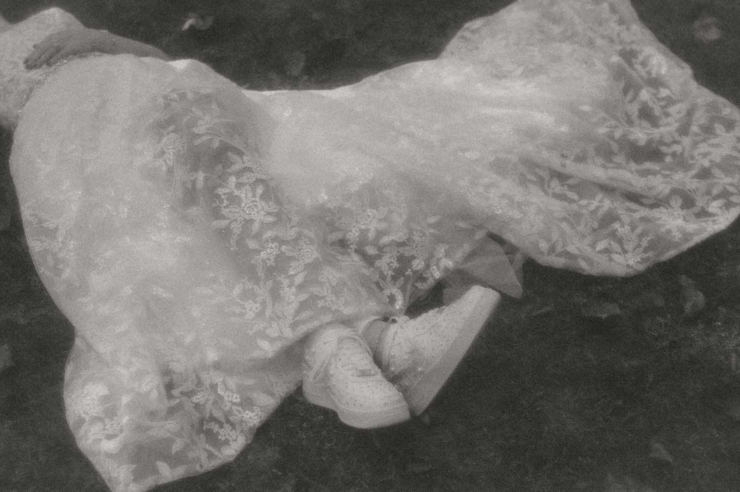 Indiana Wedding and Elopement Photographer // Close-up detail of delicate lace wedding dress fabric in black and white.