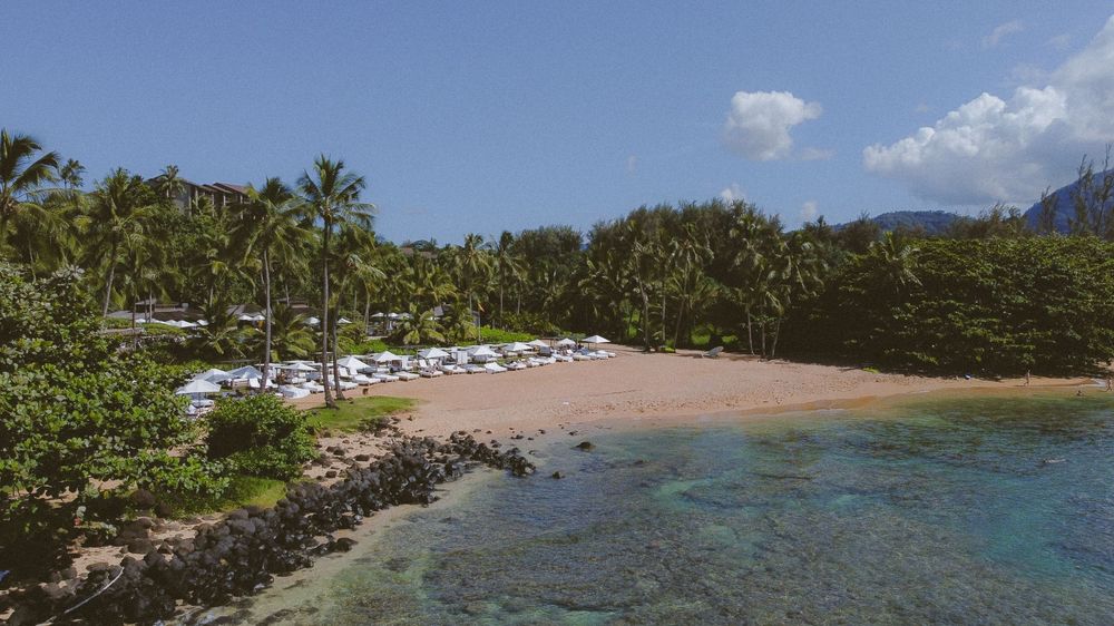 Sunset at Kauai wedding with drone footage of ceremony by Kauai Wedding Photographer