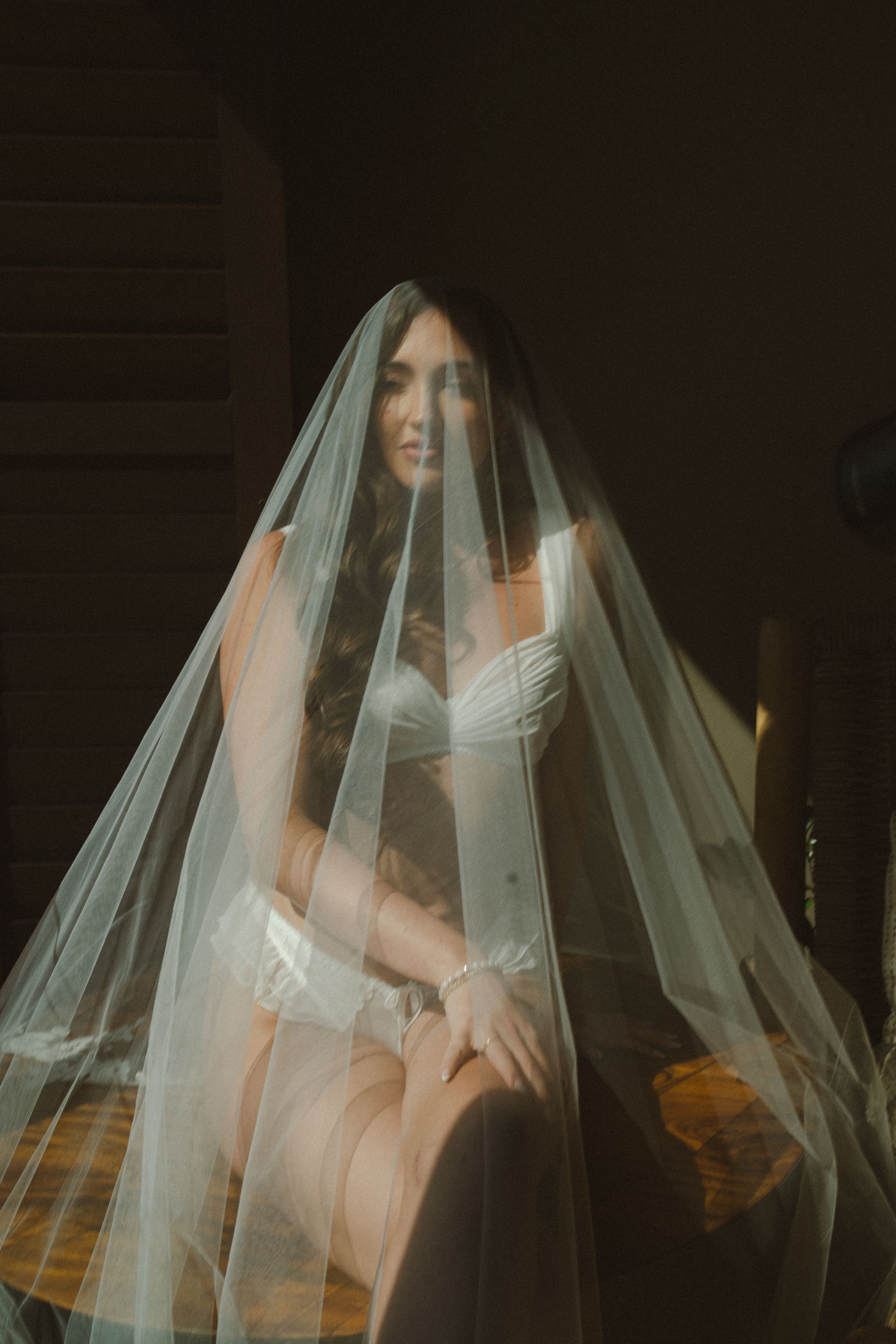 bride getting ready for kauai wedding by Kauai Wedding Photographer