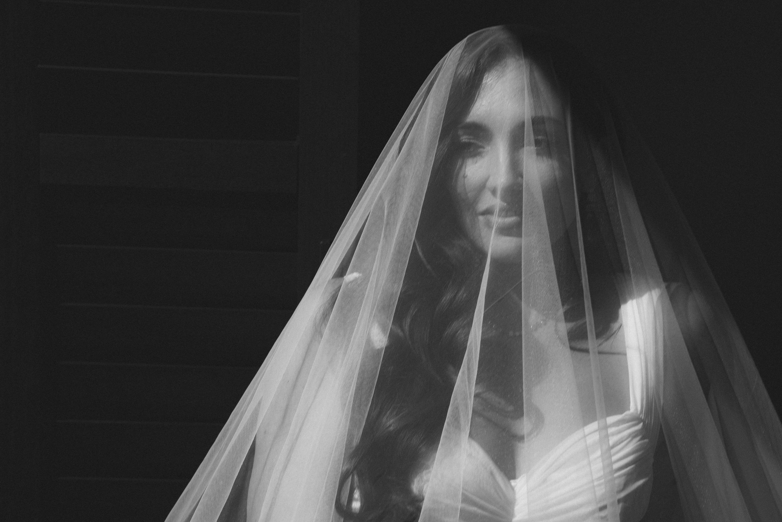 bride getting ready for kauai wedding by Kauai Wedding Photographer