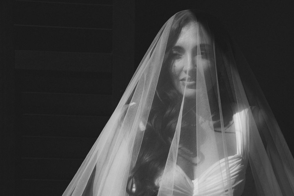 bride getting ready for kauai wedding by Kauai Wedding Photographer