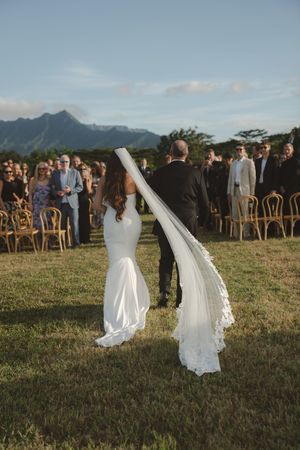 bride walking down the aisle at ceremony at kauai wedding by Kauai Wedding Photographer