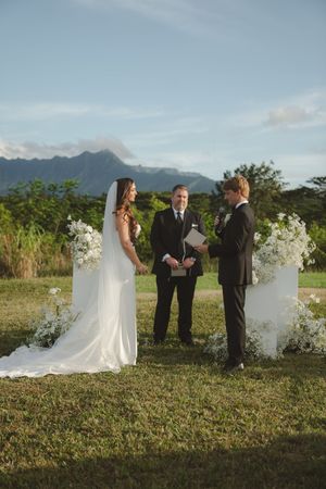 couple reading vows during ceremony at kauai wedding by Kauai Wedding Photographer