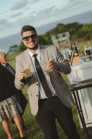 guests with drinks at kauai wedding by Kauai Wedding Photographer