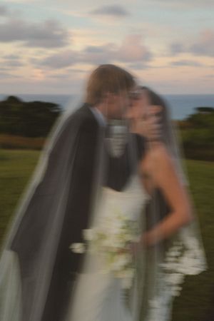 bride and groom posing at sunset at Kauai wedding by Kauai Wedding Photographer