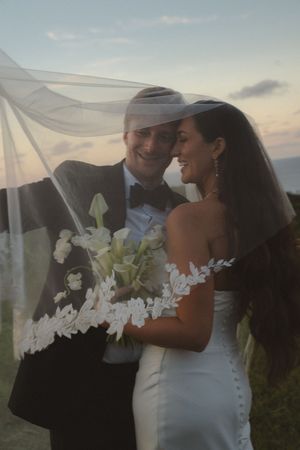 bride and groom posing at sunset at Kauai wedding by Kauai Wedding Photographer