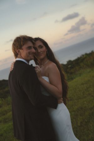bride and groom posing at sunset at Kauai wedding by Kauai Wedding Photographer