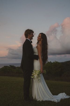 bride and groom posing at sunset at Kauai wedding by Kauai Wedding Photographer