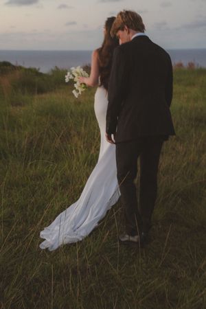 bride and groom walking at Kauai wedding by Kauai Wedding Photographer