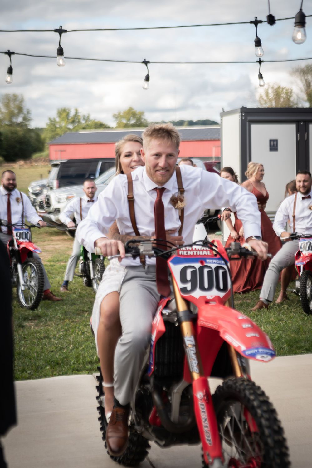 outdoor wedding couple dirtbike entrance