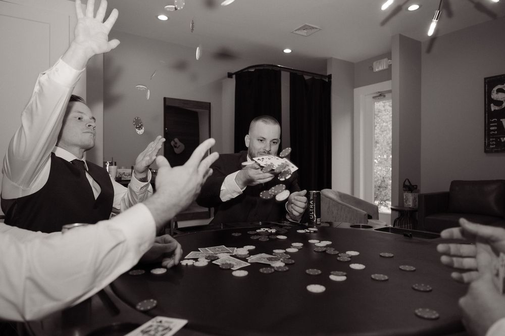 groom & groomsman playing cards on wedding day in Myrtle Beach