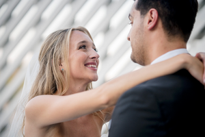 Intimate wedding couple portraits with white textured background.