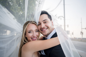 Romantic wedding portraits captured outdoors with soft natural lighting.