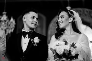 Candid black and white moments from wedding ceremony processional.