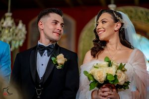 Elegant wedding ceremony captures joyful moments between couple.
