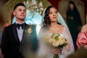 Wedding ceremony in progress with elegant decor and lighting.