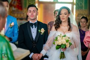 A wedding ceremony in progress with bridesmaids holding bouquets and groomsmen in formal attire.
