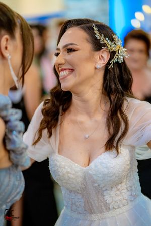 Close-up shots of a bride dancing and smiling during her wedding reception.