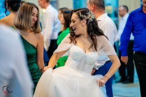 Guests enjoying themselves during a lively dance party at an elegant wedding reception.