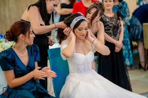 Reception guests participate in synchronized dance routine at wedding celebration.