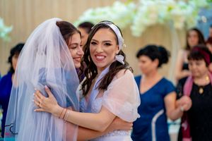 Wedding celebration features synchronized group dance performance at reception.