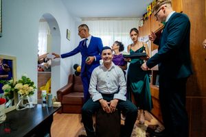 Candid moments captured during wedding preparations in a bright room.