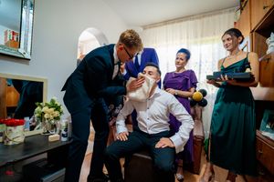 Party guests participate in a fun social game during an indoor celebration.