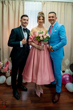 Wedding party lineup showing coordinated formal attire in indoor setting.