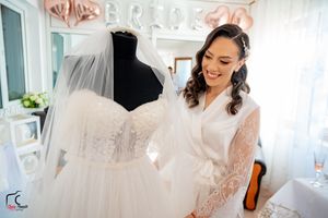 Modern bridal salon showcasing wedding dresses and elegant decor.