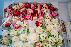 Elegant floral arrangement featuring pink and cream roses in gradient display.