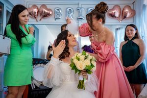 Candid wedding moments captured with bridesmaids in vibrant dresses.