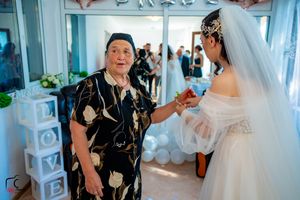 Wedding party sharing emotional moments during pre-ceremony preparations.