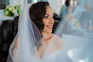 Series of romantic bridal portraits capturing candid moments and genuine expressions.